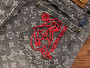 Calça Louis Vuitton Distressed Monogram Jeans